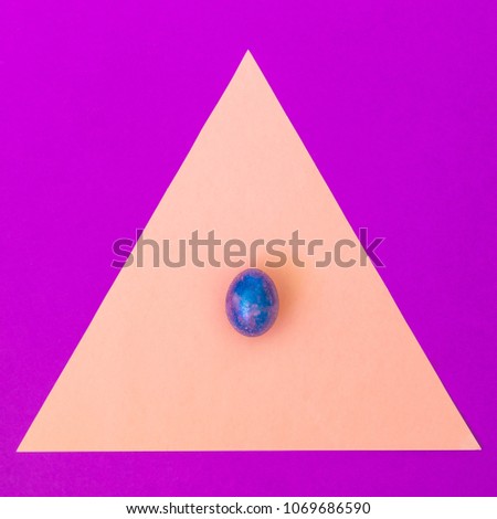 crazy magic dragon egg with cosmic pattern on pink geometric triangle background. art creative concept. minimal and surreal artwork
