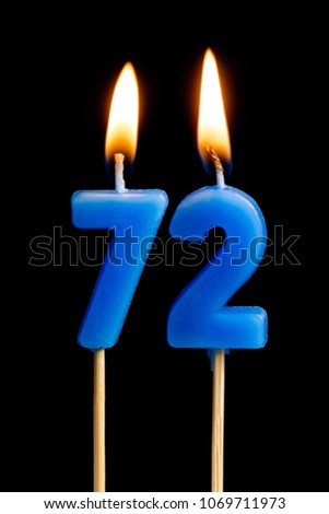 Burning candles in the form of 72 seventy two (numbers, dates) for cake isolated on black background. The concept of celebrating a birthday, anniversary, important date, holiday, table setting