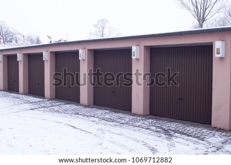 brown automatic garage for cars. for three places.