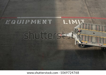 transportation truck for moving luggage of passenger to airplanes on the equipment limit zone with beautiful light