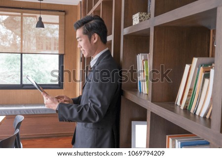 business man dressed in suit work on digital tablet