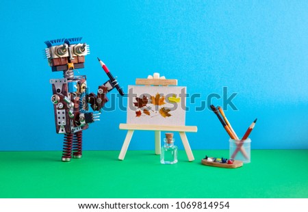 Robot artist pencil wooden easel still life artwork autumn leaves. Advertising poster studio school visual arts drawing. Artist's tools palette watercolor brushes, pencils. Blue green background