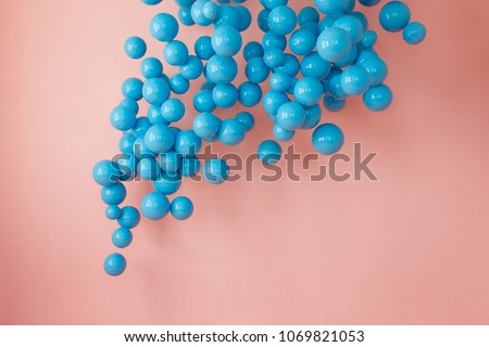 blue balloons, blue bubbles on pink background. Modern punchy pastel colors. Dreaming concept Royalty-Free Stock Photo #1069821053