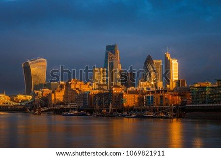 London, England - Amazing dramatic sky and golden hour sunlight 