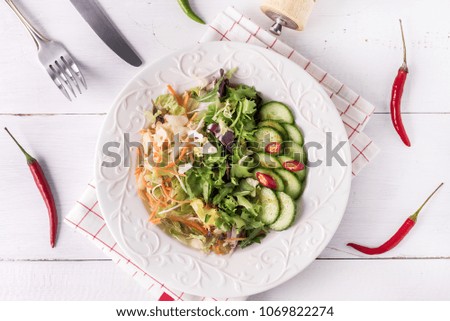 Fresh Tasty Salad with Cucumber Mix of Salad and Chili Top View Flat Lay White Wooden Background