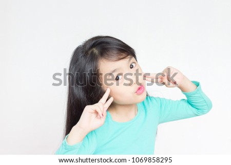asian child wear lipstick and pose lovely on white background