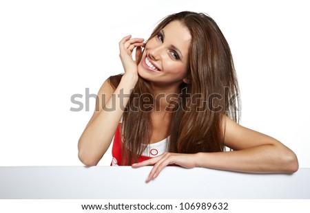 Happy smiling beautiful young  woman showing blank signboard, isolated over white background