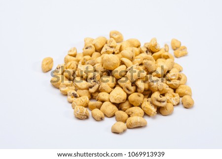 Roasted soft corn snack isolated on white