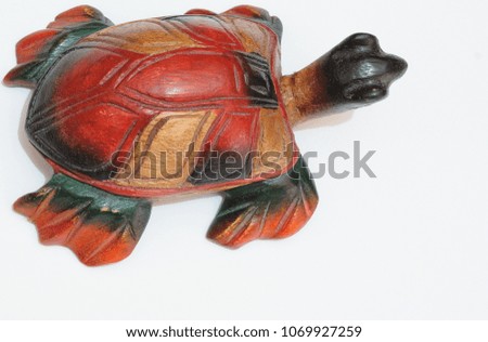 Small colored wooden turtle
