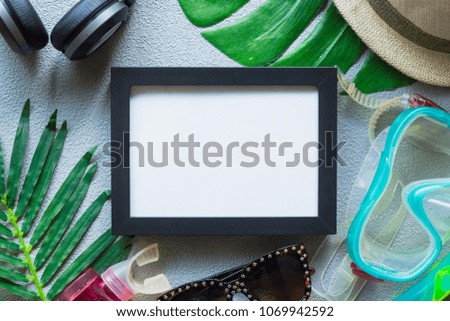 summer holiday flat lay of copy space with sunglasses, picture frame and snorkel on background texture, summer colorful concept