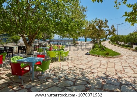 Quay with benches and tables in Finike, province of Antalya. Turkey
