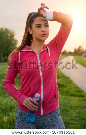 Young woman resting after jogging
