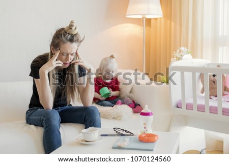 Frustrated mom feeling exhausted Royalty-Free Stock Photo #1070124560