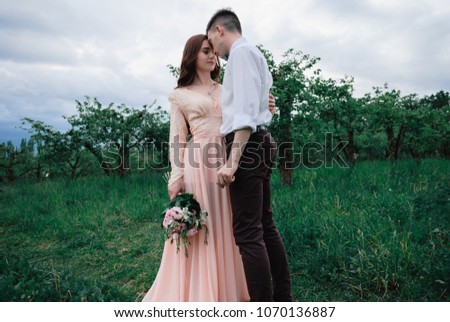 Nice outdoor wedding photography of young beutiful couple in summer park