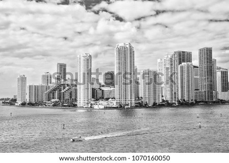 Miami skyline skyscrapers ,yacht or boat sailing next to Miami downtown, Aerial view, south beach