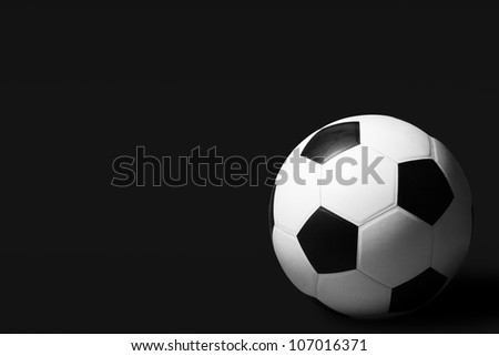soccer ball on dark background Royalty-Free Stock Photo #107016371