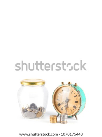 Jar with coins and clock isolated on white