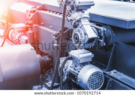 Industrial automotive machine tool equipment close up, abstract industry manufacturing metalwork background, blue toned Royalty-Free Stock Photo #1070192714
