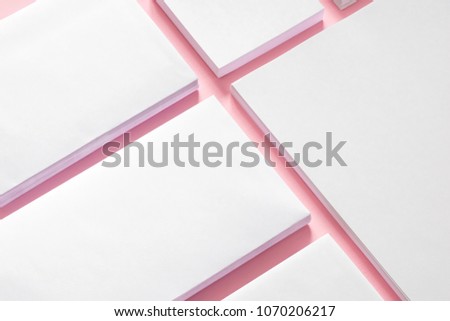 Modern soft pink stylish working space office. Mock up for branding, graphic designers presentations and portfolios, Blank white stationery, blank notepad, letterhead, business card. Flat lay