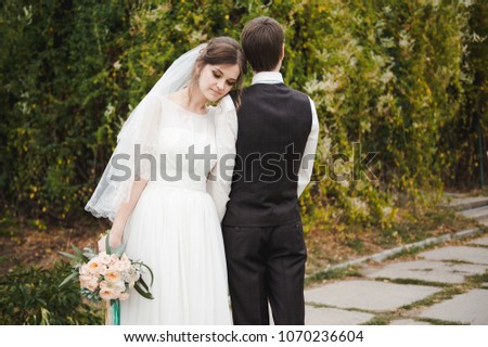 Bride and groom in the park. Wedding. Loving wedding couple outdoor. 