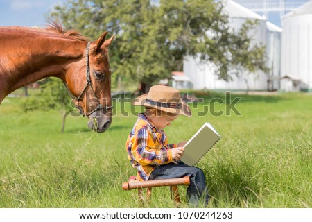 Horse reading a book with the child