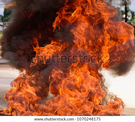 Close up flame on a tray for fire training event.Fire frame texture background.
