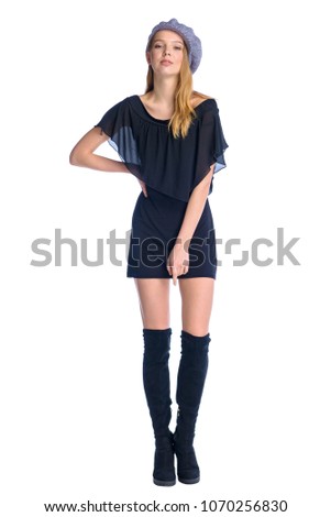 Textile, design, clothing, fashion concept. Fashionable beautiful slender girl demonstrating clothes. Casual young woman in street style.  Full body length portrait isolated over white background