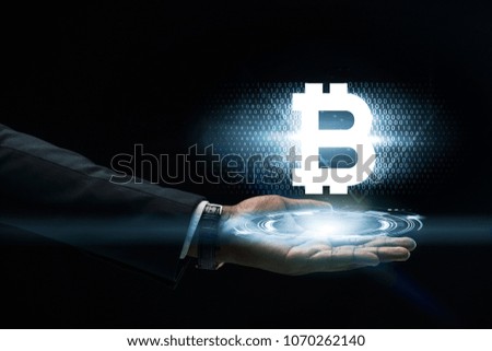 Abstract art of Hand of Business man Holding the virtual hologram future system.  Innovation Business Financial and Technology concept.