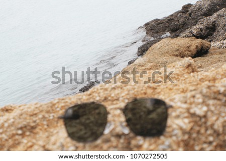 Sunglasses with beautiful seashore.