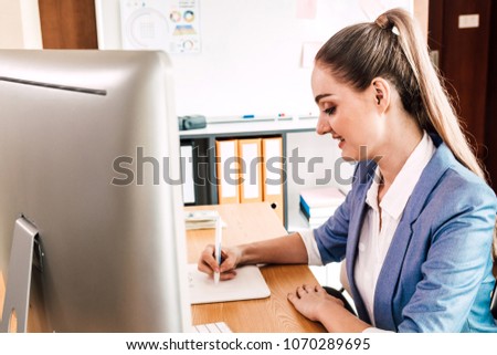 Woman graphic designer working with computer and drawing on graphic tablet at the office.Graphic Designer creativity concept