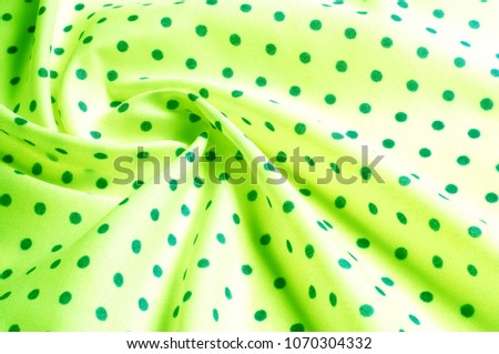 Texture. Drawing. background. silk fabric is green, polka. this bi-directional silk fabric is ideal for design, your creativity and decor. Colors include green on the green points of the polka.