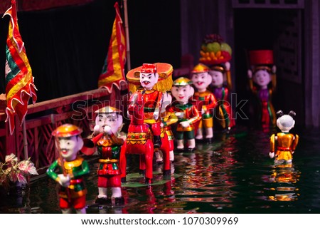 Traditional Vietnamese cultural water puppet theatre show in Hanoi, Vietnam water puppetry, Hanoi, Vietnam. Royalty-Free Stock Photo #1070309969