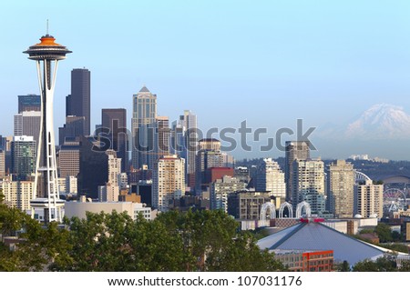 Seattle skyline at sunset and Mt.Rainier.