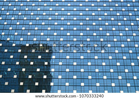 Outer walls and white spots of glass buildings.