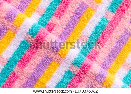 Colorful striped beach towel use for beautiful background patter