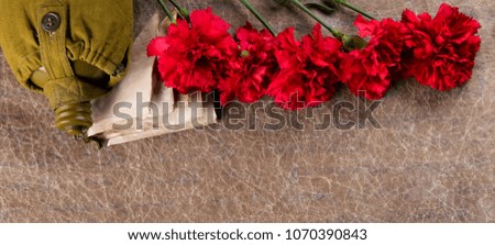 a set of old letters, with carnations and a flask, on a texture background with an inscription