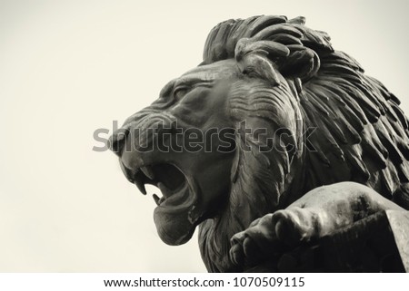 Statue of a lion muzzle in profile Royalty-Free Stock Photo #1070509115