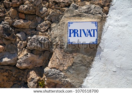 Sign with lettering Private on a natural stone wall