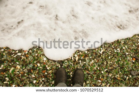 colorful glass pebbles blanket this beach in Vladivostok,Russia, the beach was used as a garbage dump years ago, nature has tumbled the glass and polished it making it a tourist destination