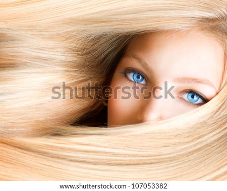 Blond Girl. Blonde Woman with Blue Eyes. Healthy Long Blond Hair. Hair Extension Royalty-Free Stock Photo #107053382