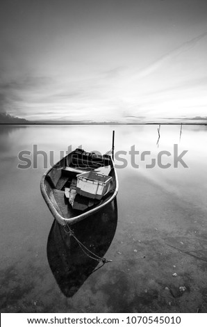 Fine art image in black & white of fishermen boat at Tumpat Kelantan, Malaysia. Soft Focus due to long exposure.