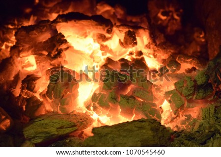 Close up of fading embers with heat hiding among them.