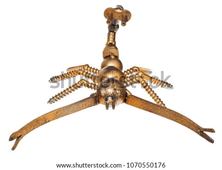 Handmade from car and motorcycle parts, scorpion. Arachnid made of motor bearing elements, drive chain, poultry, screws and other mechanical elements. Object isolated on a white background.