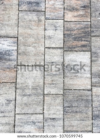 Detail of a textured stone tiled sidewalk