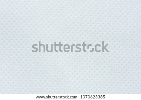 White perforated paper texture background. Dotted white panel surface 
