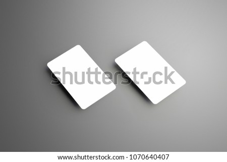 Concept business white mockup of a two  bank gift cards isolated  on a gray background. Ready to used in your template.