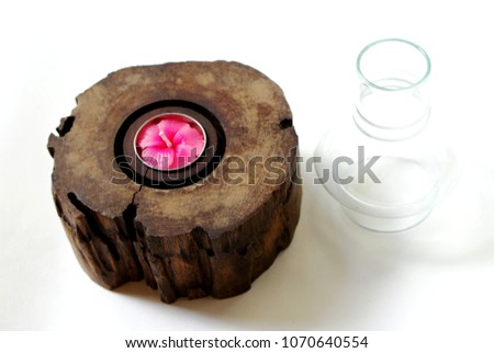Selective focus picture of old wooden lamp with pink flower candle and glass  isolate white background, Close up abstract soft focus background