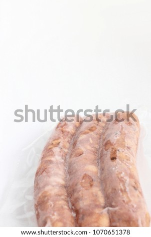 Sausage of frozen vacuum pack