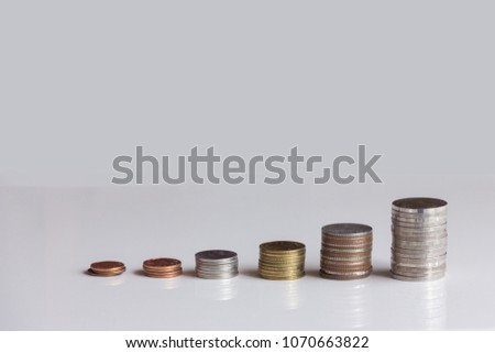 Thai coin stack on white table
