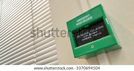 emergency door switch green install on the wall with  on fire for ringing the bell alarm
